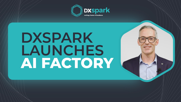 DXspark banner announcing “DXspark Launches AI Factory”, featuring a photo of a smiling man with glasses and grey hair, dressed formally and facing the camera.